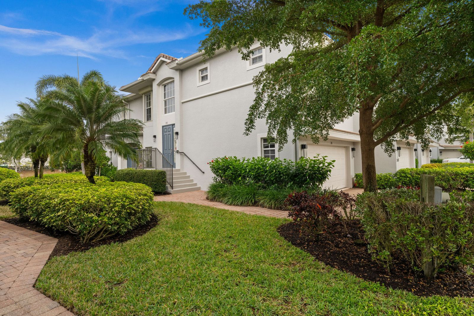 Landscaped green space with palms
