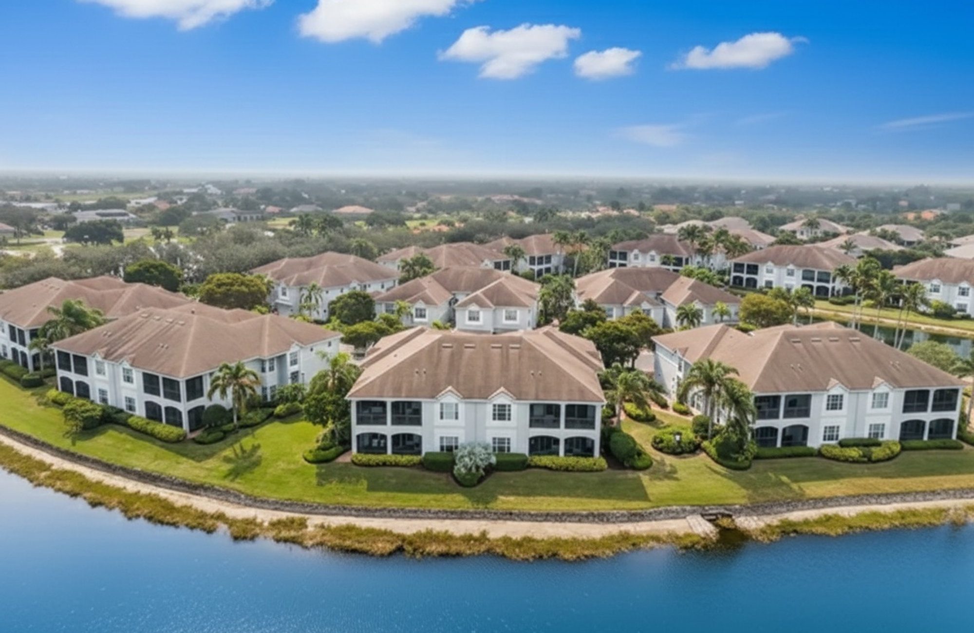 Aerial view of Banyan Woods and the lake that wraps around the community in Naples